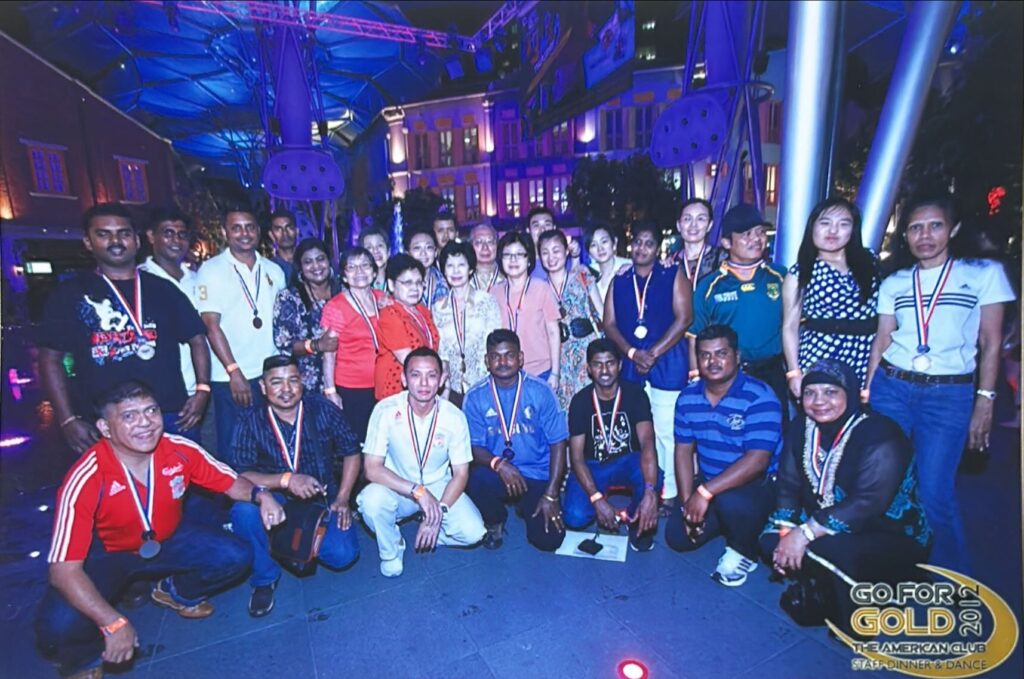 Mr Ho and colleagues at the Employee Dinner & Dance in 2012